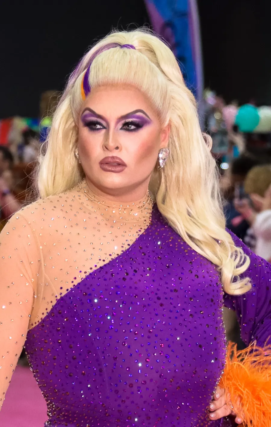 Cheryl in a sparkling purple drag look at DragCon