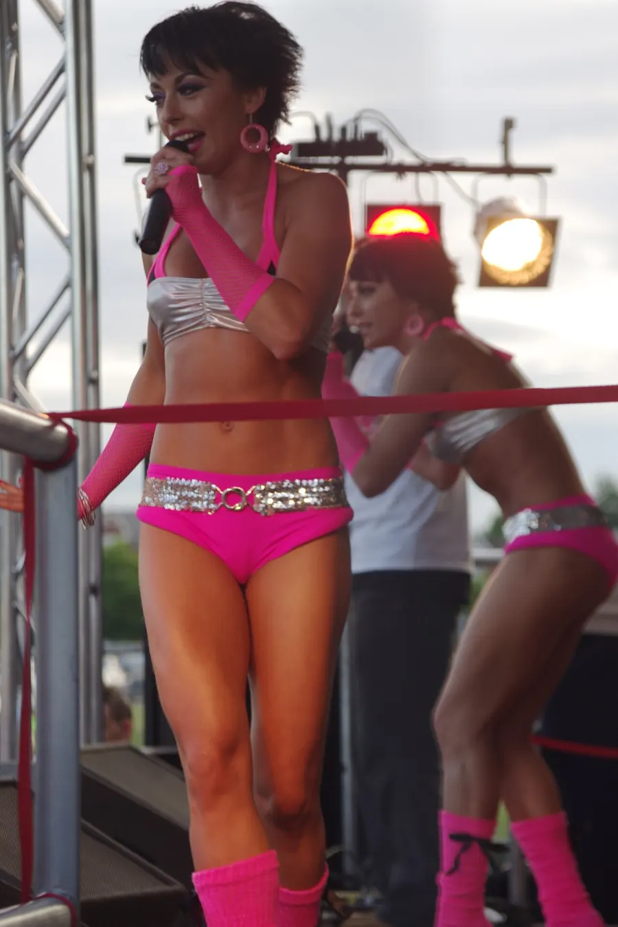 The Cheeky Girls performing together on a Pride stage